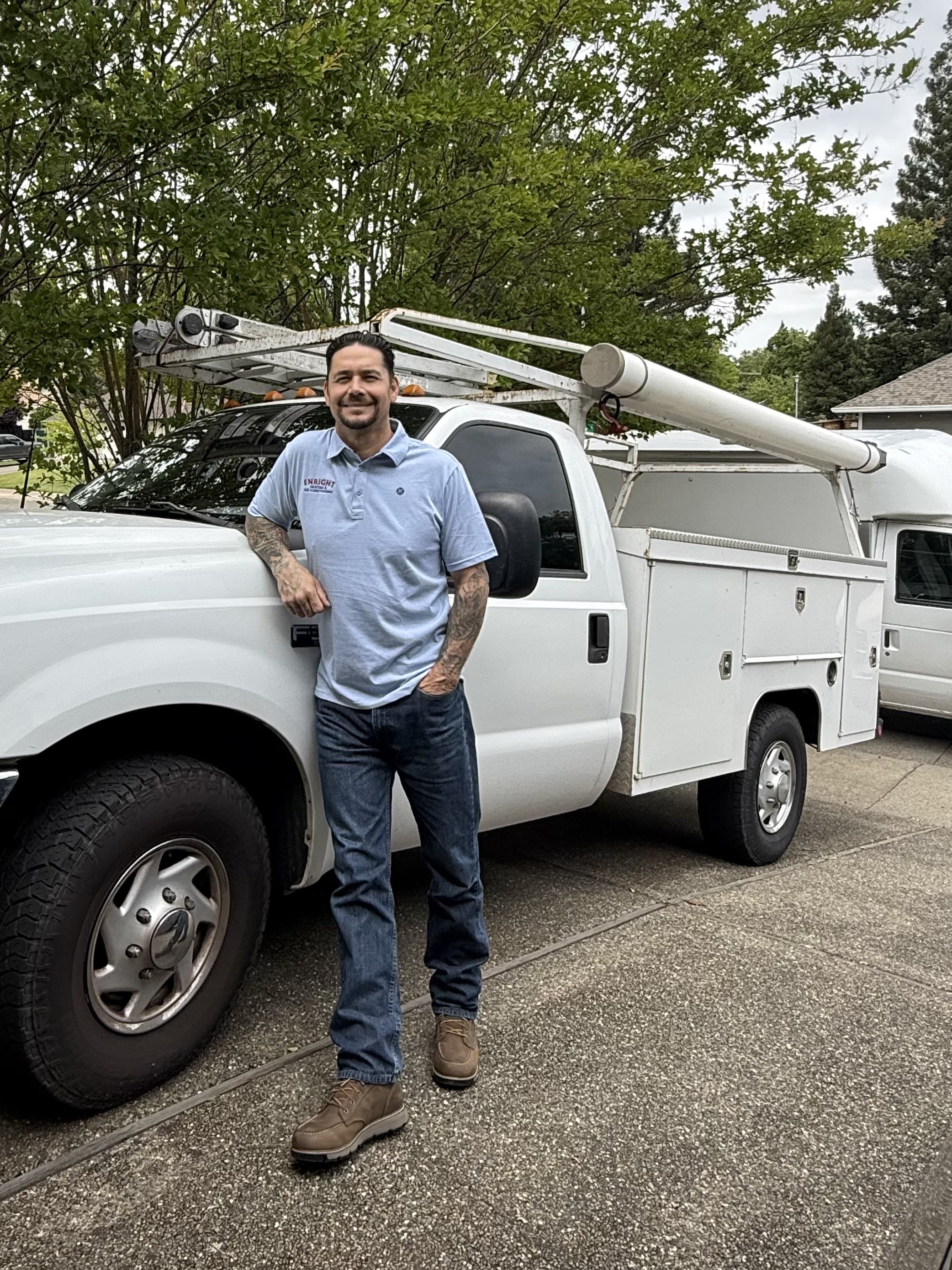 Patrick Enright, owner of Enright Heating & Air Conditioning, with his service truck