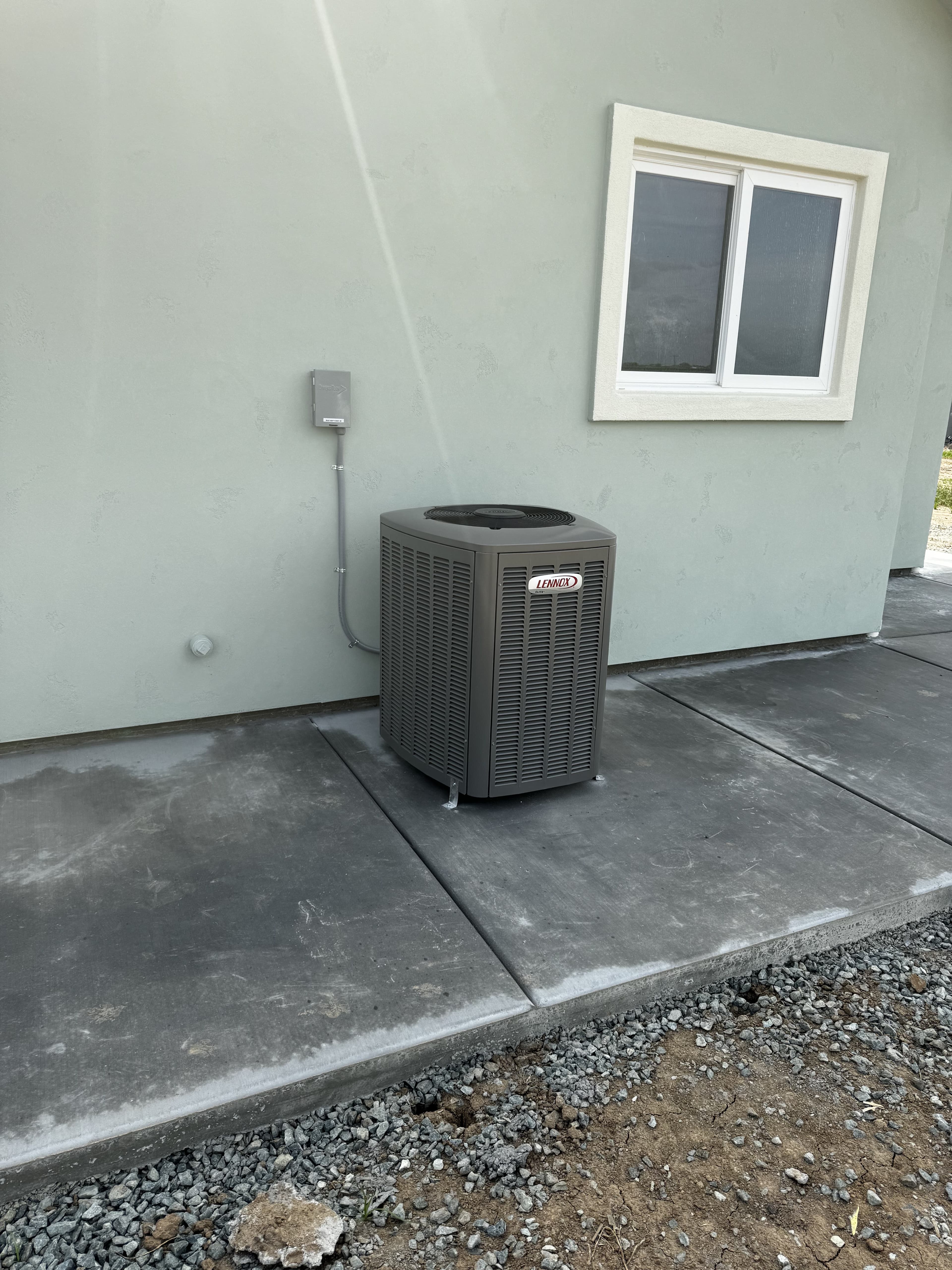 New high-efficiency Lennox AC condenser installation