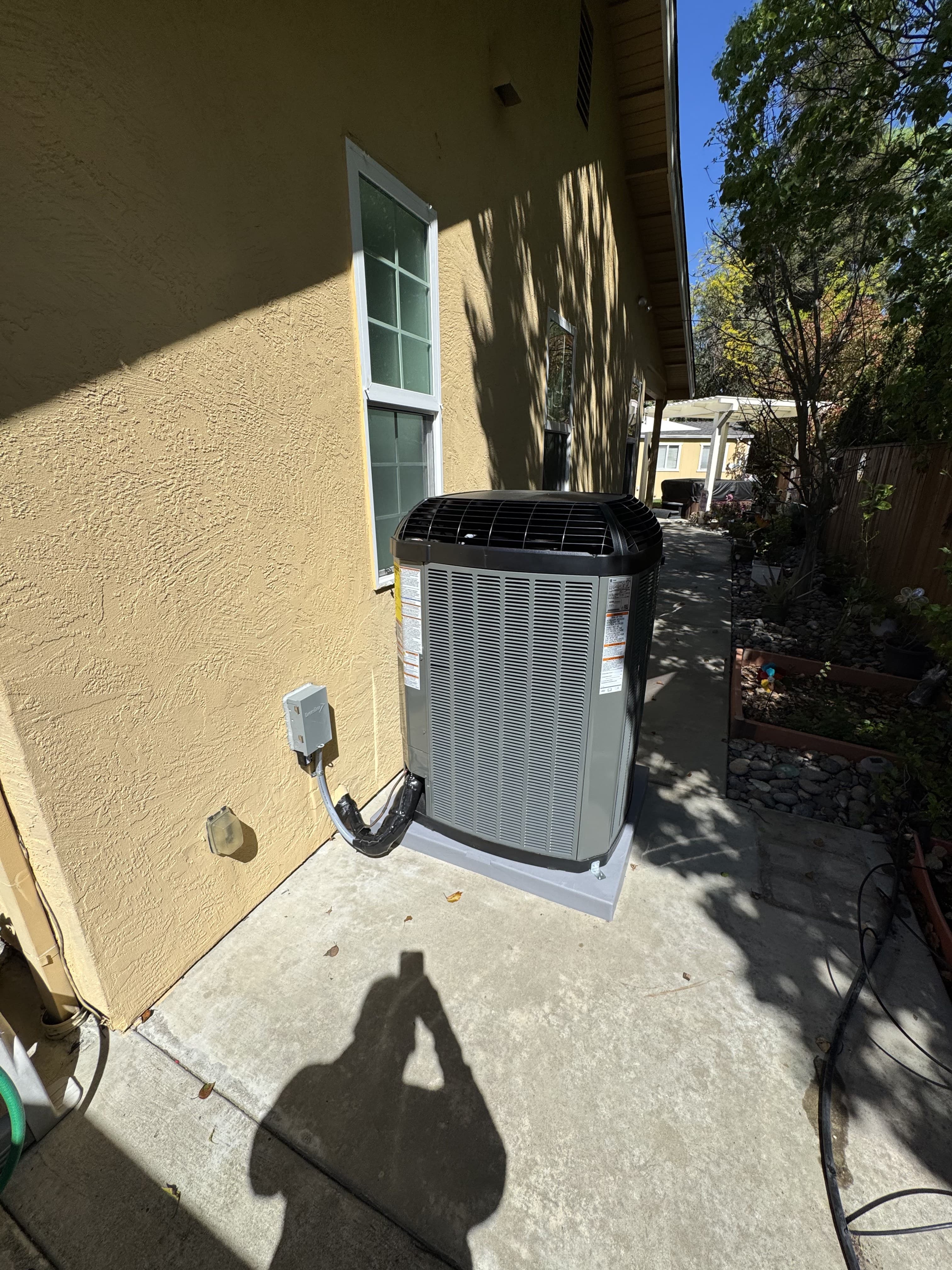Trane AC condenser cleanly installed in a Folsom side yard